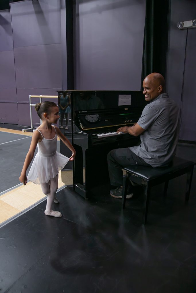 Young student with class pianist at American Ballet Theatre William J. Gillespie School at the Segerstrom Center for the Arts - Photo courtesy of The Center