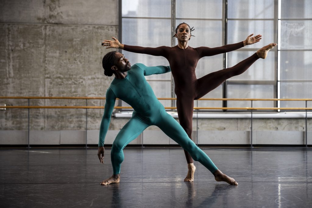 "Landrover" by Merce Cunningham - Dancers Jacquelin Harris (brown costume) and Chalvar Monteiro (teal costume) - Photo by Maria Baranova