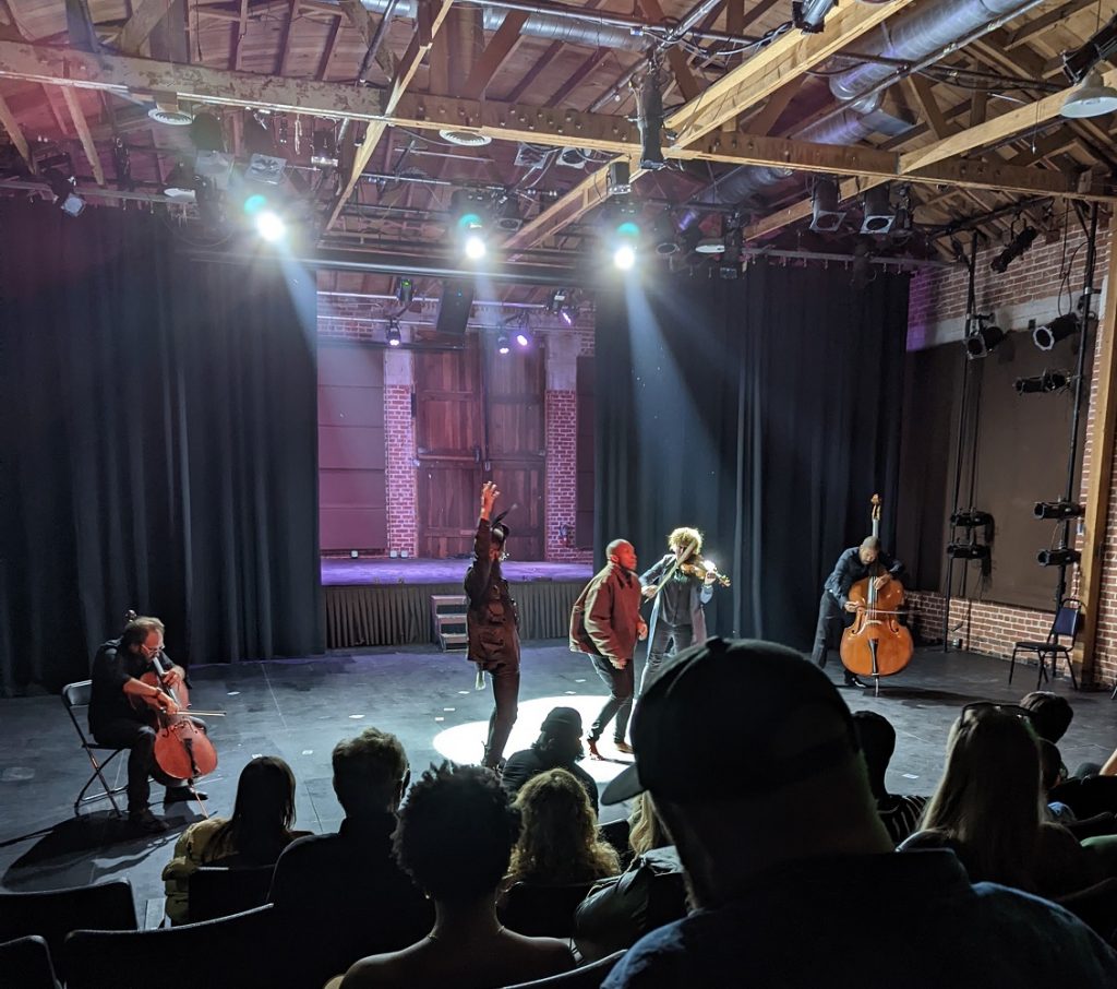 Emer Kinsella (center) performing - Photo by Rio Rodriques