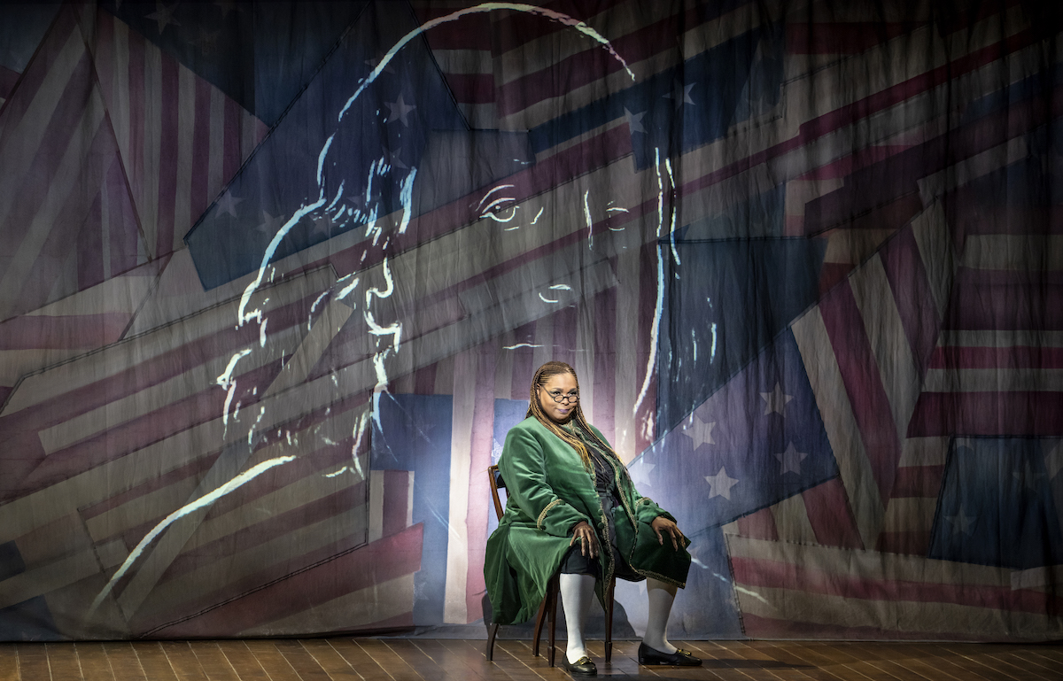 Liz Mikel as Benjamin Franklin in “1776.” Photo by Joan Marcus