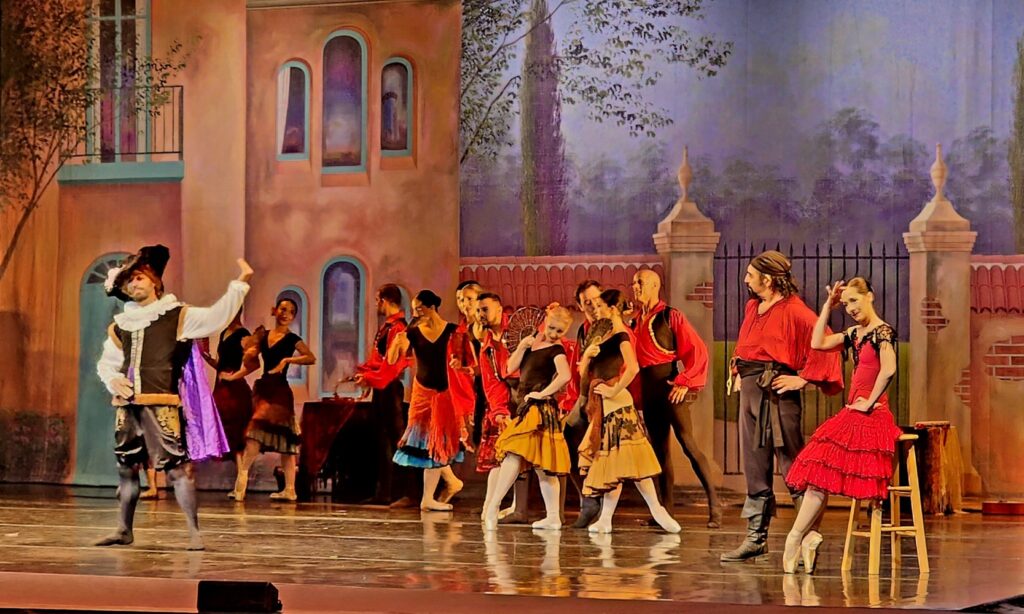 PBDT - Don Quixote - Dancer Arin Norhadian as Gamasch with Damara Titmus seated ad Kitri with Corps de Ballet - Photo by Richard Gilkerson