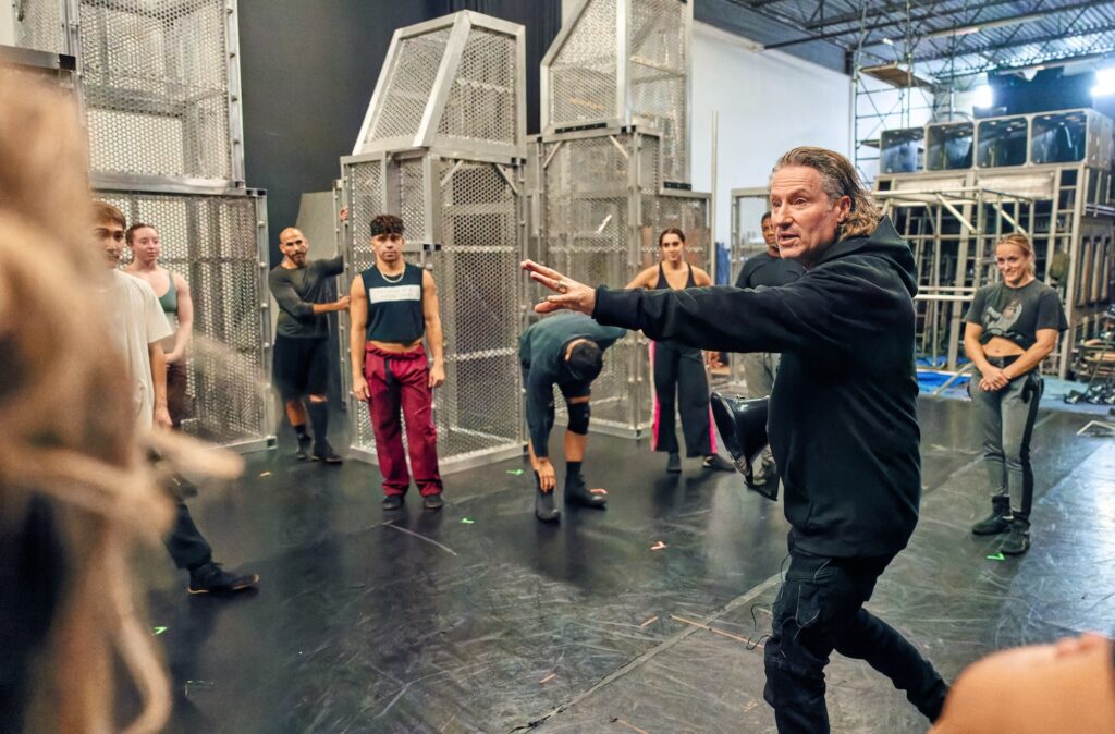 Jacques Heim directing Diavolo Architecture dancers in rehearsal for "Existencia" - Photo by George Simian.