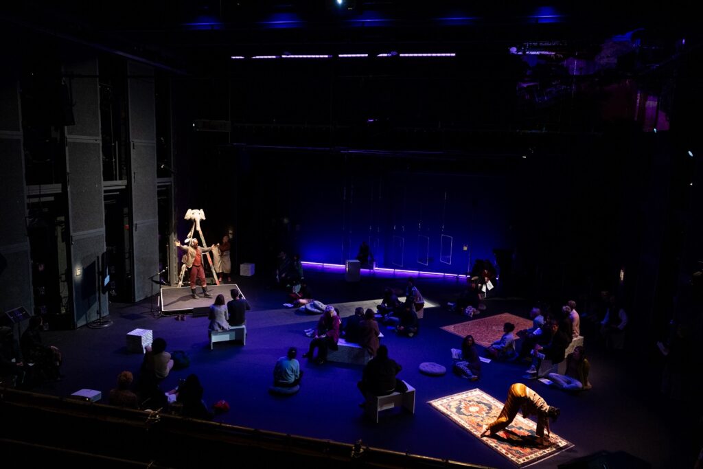 Lionel Popkin (on platform) and Arushi Singh (on rug to the right) in Popkin's Reorient the Orient at REDCAT - Photo by Angel Origgi.