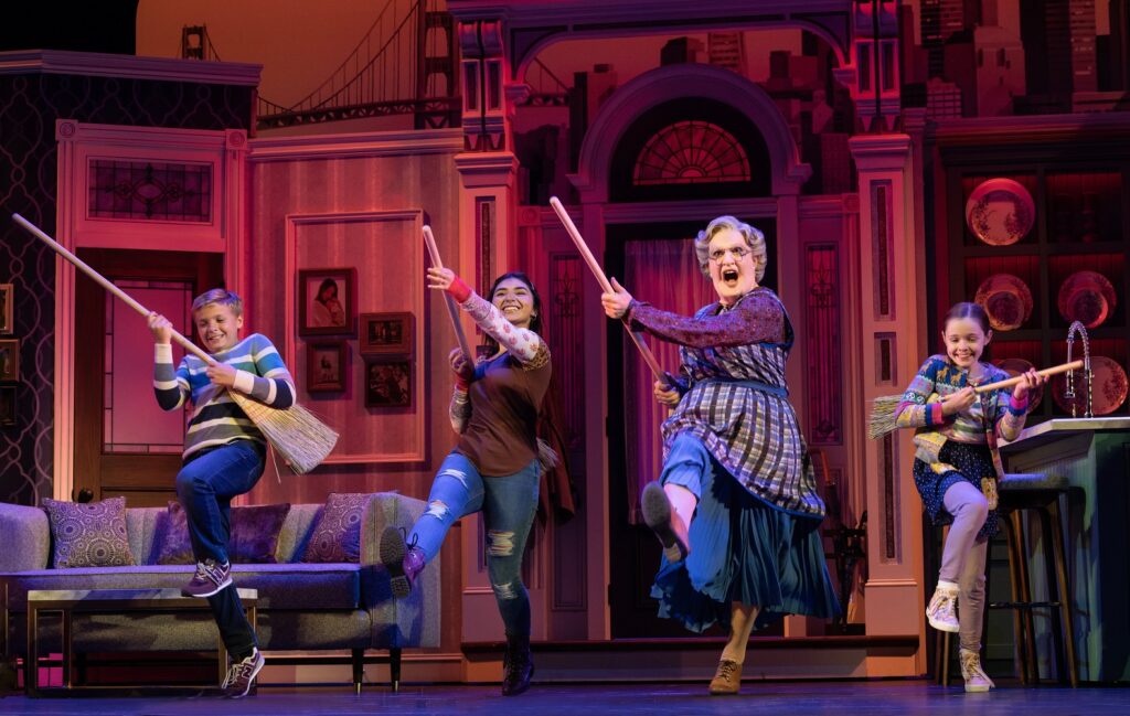 Mrs. Doubtfire - L to R Axel Bernard Rimmele as Christopher Hillard, Giselle Guiterrez as Lydia Hillard, Rob McClure as Euphegenia Doubtfire, and Kennedy Alexandra Pitney as Natalie Hillard - Photo by Joan Marcus.