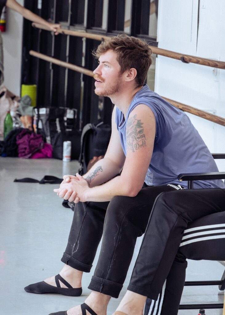 Chasen Greenwood conducting rehearsal - Photo by Hannah Cox Photo.