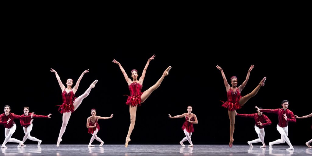 Pacific Northwest Ballet soloist Amanda Morgan (center) with company dancers in "Rubies" from "Jewels", choreography by George Balanchine © The George Balanchine Trust - Photo by Angela Sterling.