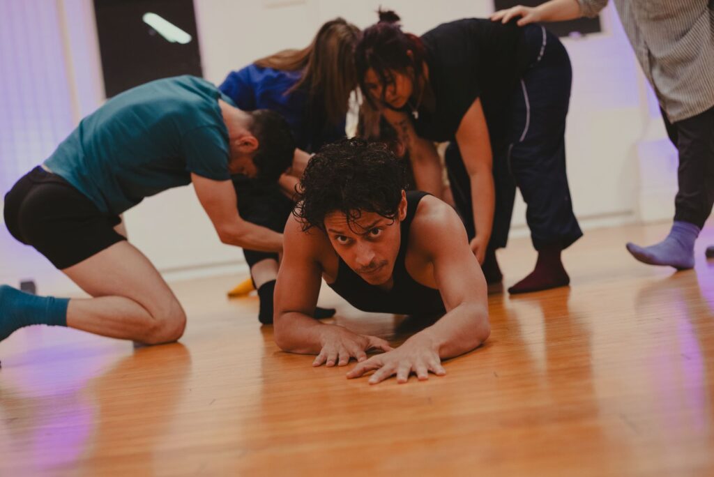 Cast of Bodies In Play - Daurin Tavares in foreground - Photo by Winnie Wu.