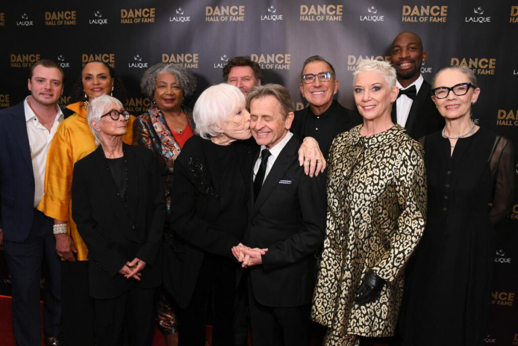 Shirley MacLaine plants a kiss on fellow honoree, friend and “The Turning Point” co-star Mikhail Baryshnikov at the inaugural Dance Hall of Fame ceremony - Photo includes Inductees and Presenters - Photo courtesy of Getty Images.