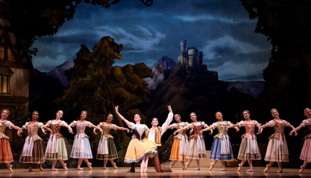 Pacific Northwest Ballet principal dancers Elizabeth Murphy and Christopher D’Ariano as Giselle and Albert, with PNB company dancers in Peter Boal’s acclaimed staging of Giselle - Photo by Angela Sterling.