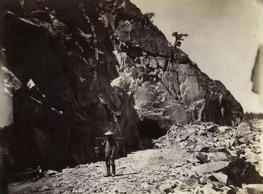 A Chinese immigrant laborer at the site of a tunnel under excavation during construction of the Transcontinental Railroad. Alfred A. Hart, Stanford University Archives and Collections - Photo courtesy of Latino Theatre Co.